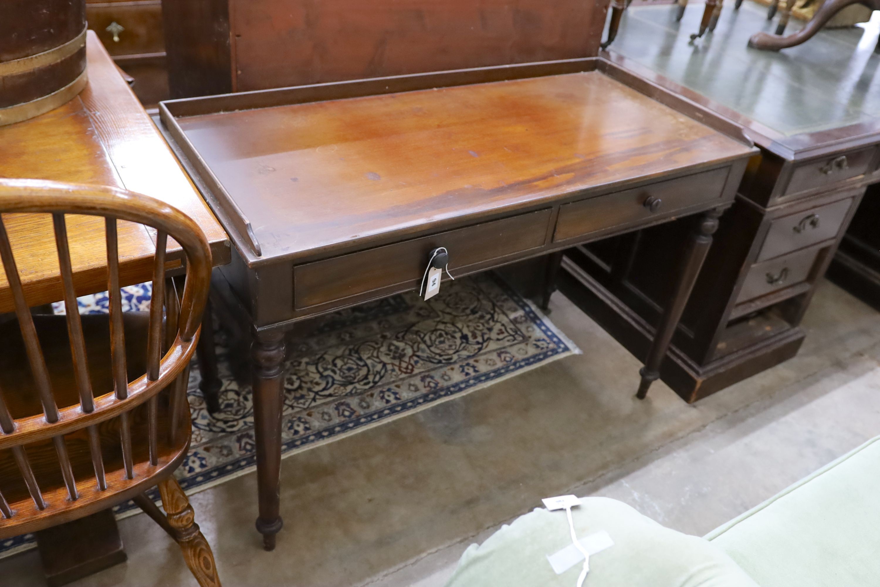 An early Victorian mahogany washstand, with a three quarter galleried top, width 115cm, depth 53cm, height 79cm